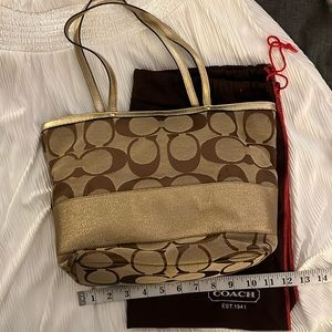 Coach Signature tote with gold accents